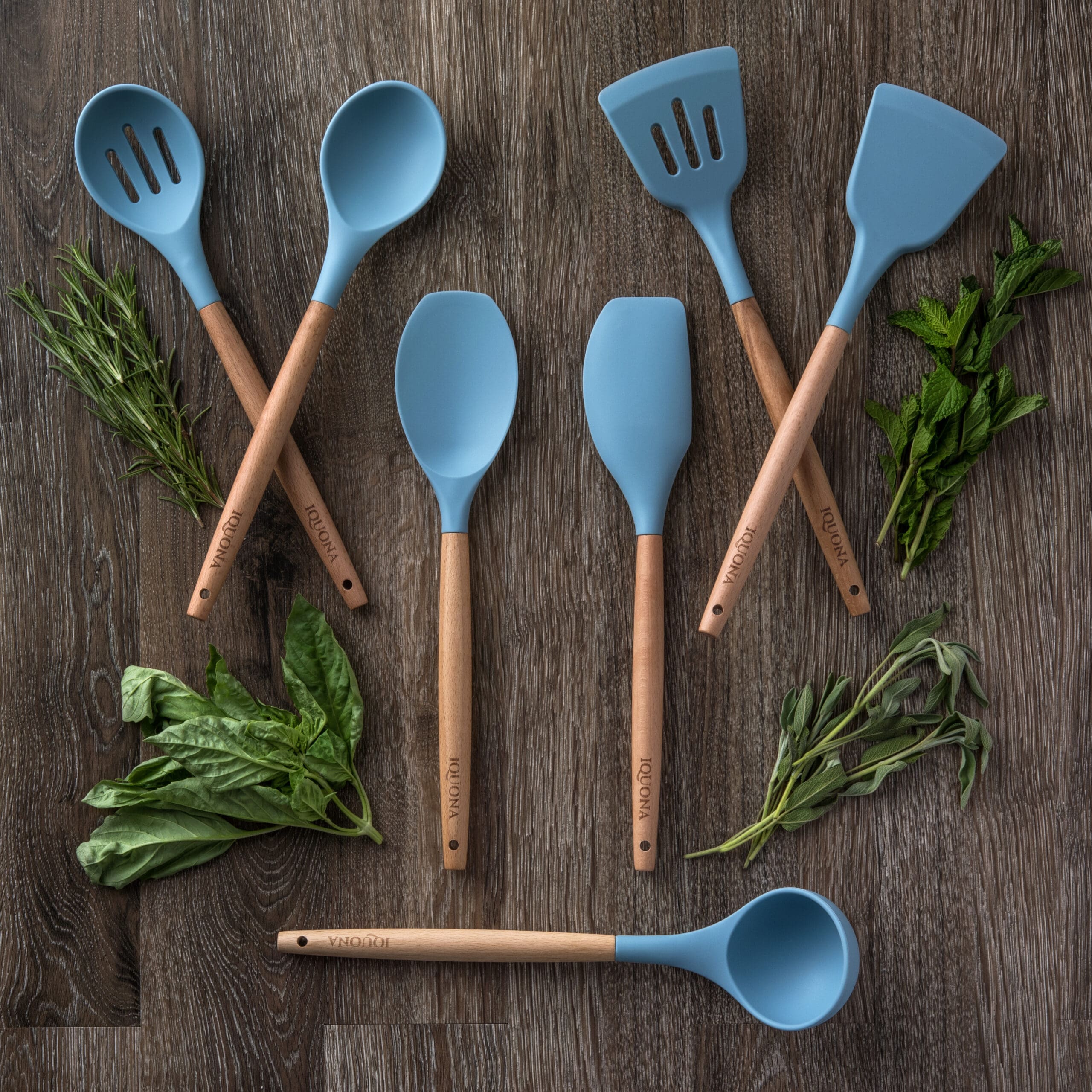Set of silicone serving utensils on a wood background